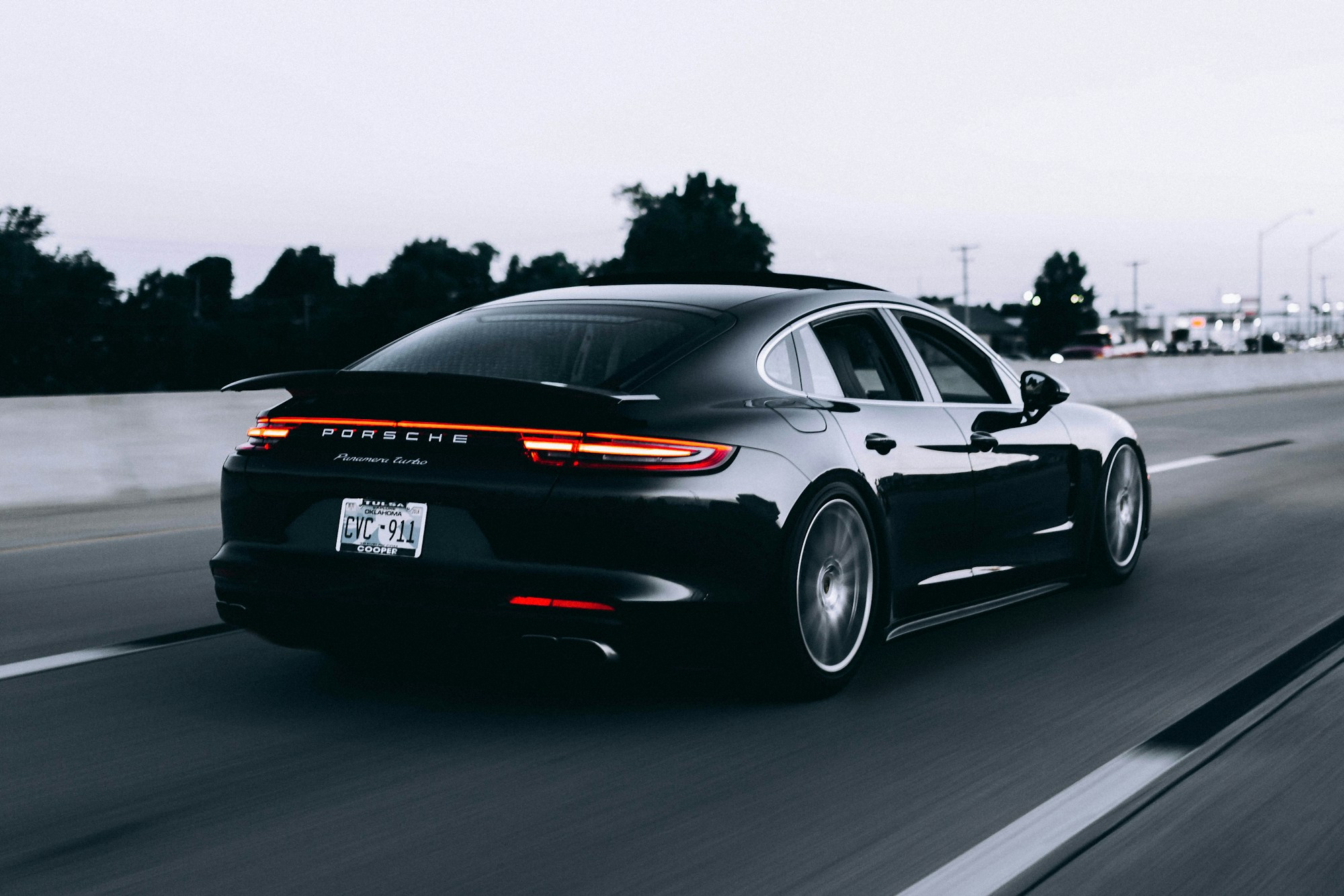 Silver Porsche on an open road